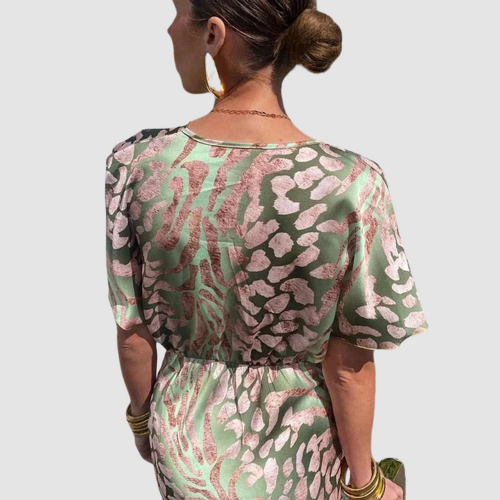 Mikaela™ maxi dress back view, green leopard print with elastic waist and short flutter sleeves