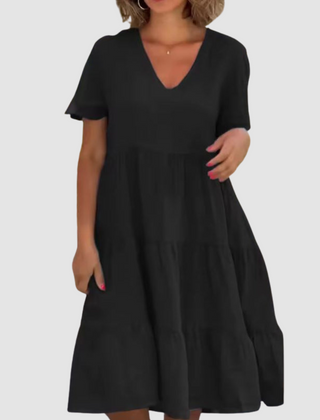 Black V-neck short-sleeve soft dress with tiered ruffle skirt and relaxed A-line cut