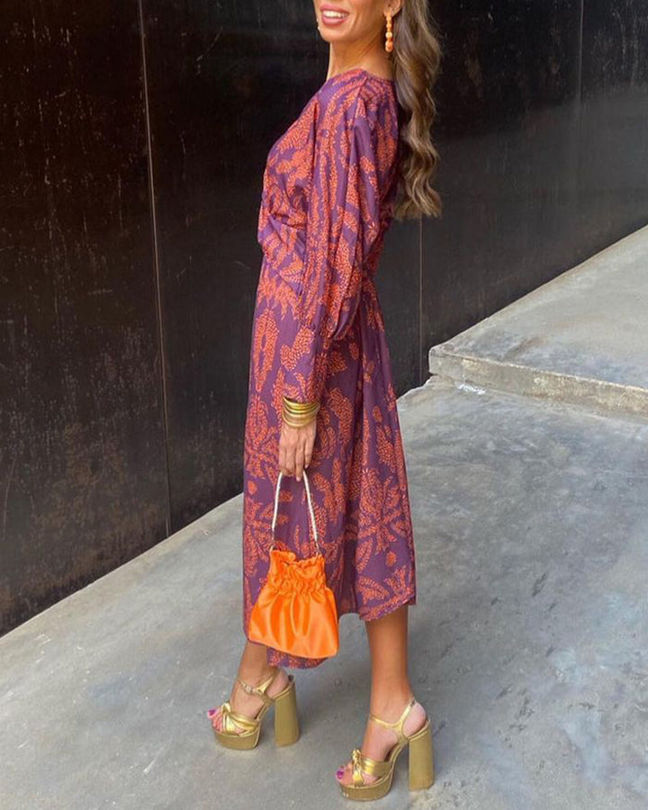 Purple patterned midi dress with V-neck, knotted waist and long sleeves