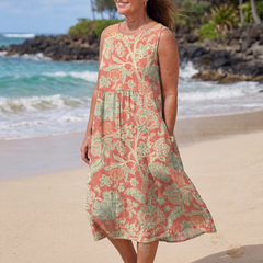Floral beach midi dress, coral and green sleeveless cut with relaxed tiered hem
