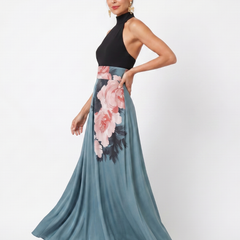 Black halter bodice maxi dress with teal skirt and pink floral panel, side view
