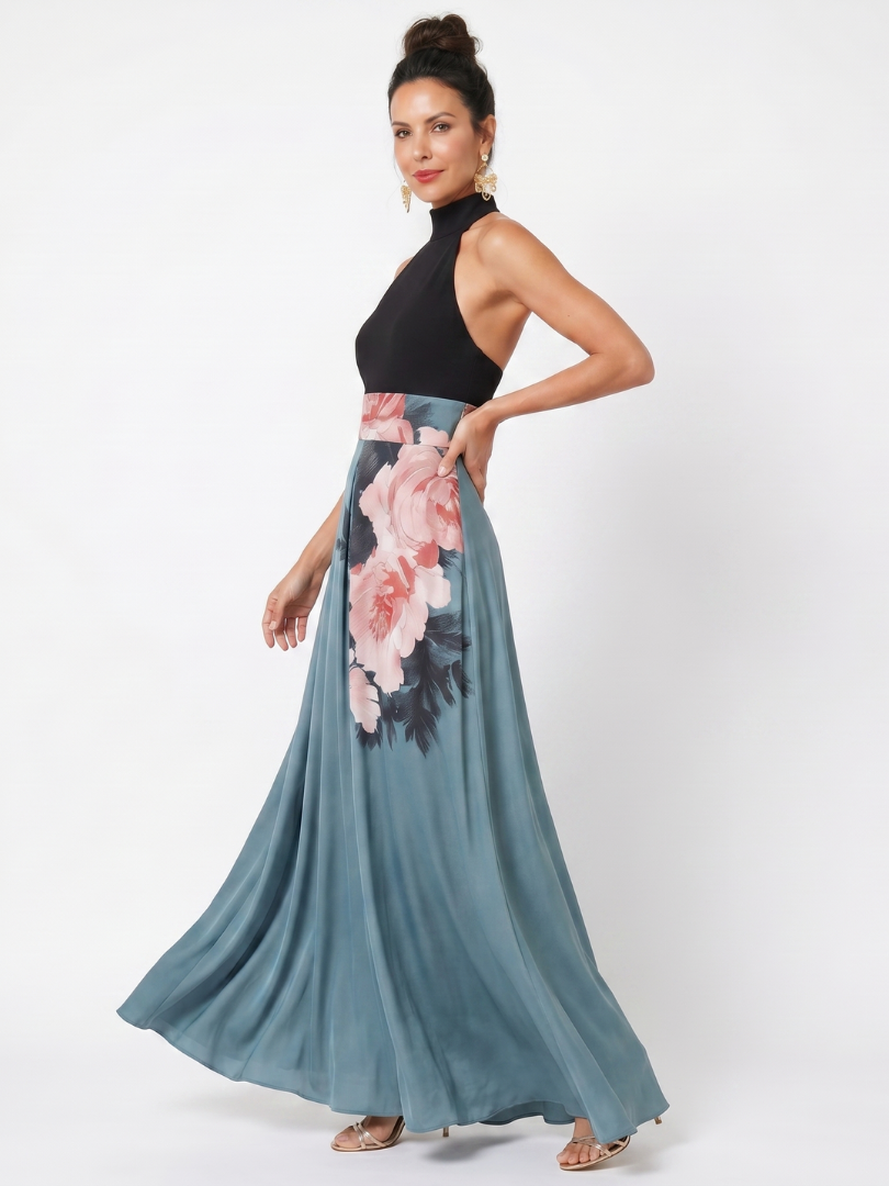 Black halter bodice maxi dress with teal skirt and pink floral panel, side view
