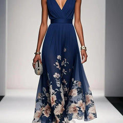 Navy blue sleeveless V-neck floral dress with draped waist and flowing midi skirt