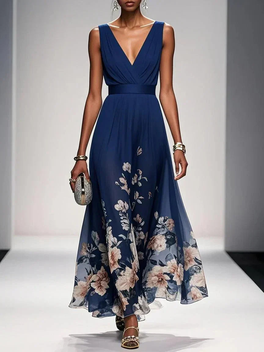 Navy blue sleeveless V-neck floral dress with draped waist and flowing midi skirt