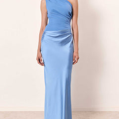 One-shoulder satin maxi dress in light blue with pleated waist and long straight silhouette.
