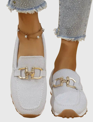 White orthopedic loafer sneakers with gold-tone buckle detail and grippy sole