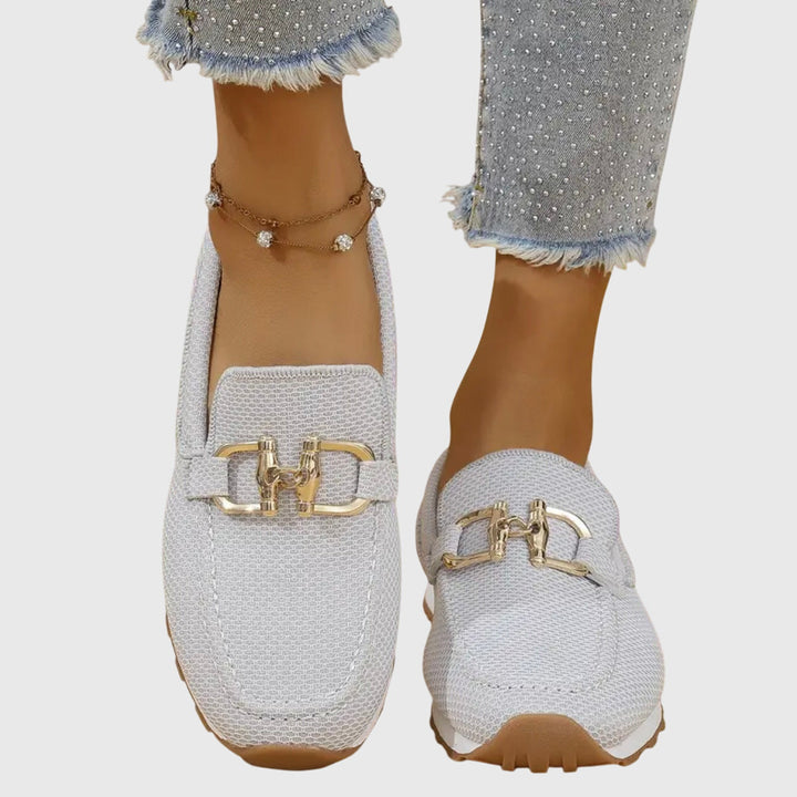 White mesh orthopedic loafers with gold buckle ornament and treaded sole