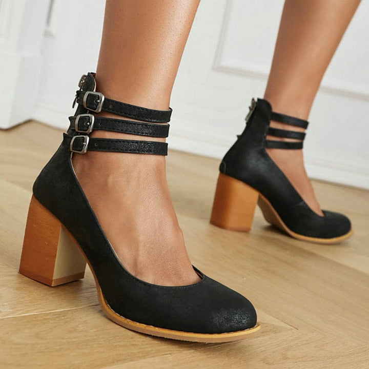 Black triple-buckle ankle strap heels with thick block heel