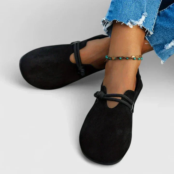 Black orthopedic loafer slip-on with low profile and front strap closure