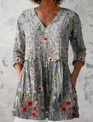 Gray long V-neck blouse with 3/4 sleeves and colorful floral embroidery pattern
