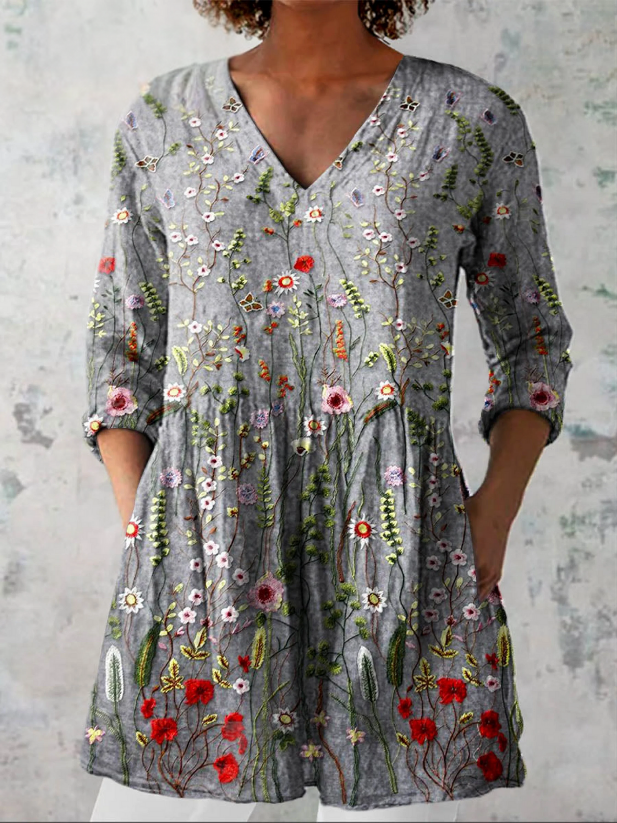 Gray long V-neck blouse with 3/4 sleeves and colorful floral embroidery pattern