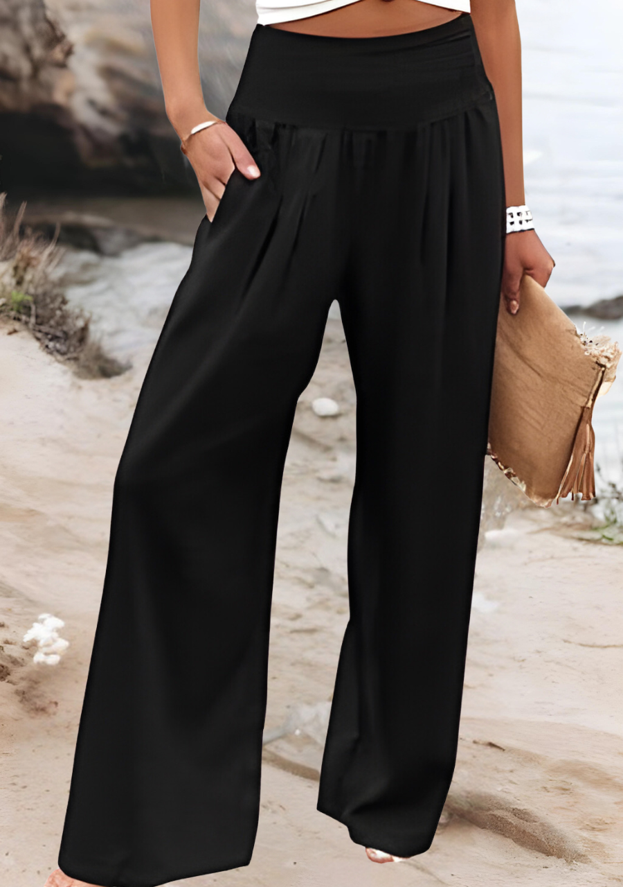 Loose summer pants in black with elastic smocked waistband and wide-leg silhouette