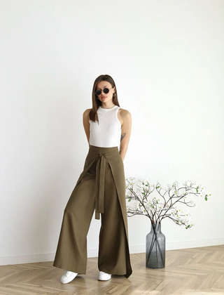 Olive green wide-leg trousers with front waist tie and relaxed wide flared legs