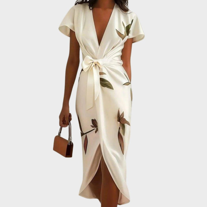 White wrap dress with V-neck, short sleeves, tie waist, floral bird print
