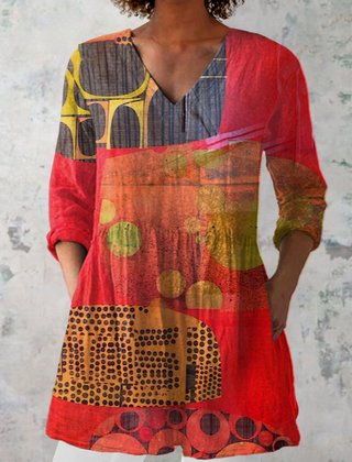 Red long V-neck blouse with abstract geometric print and 3/4 sleeves.