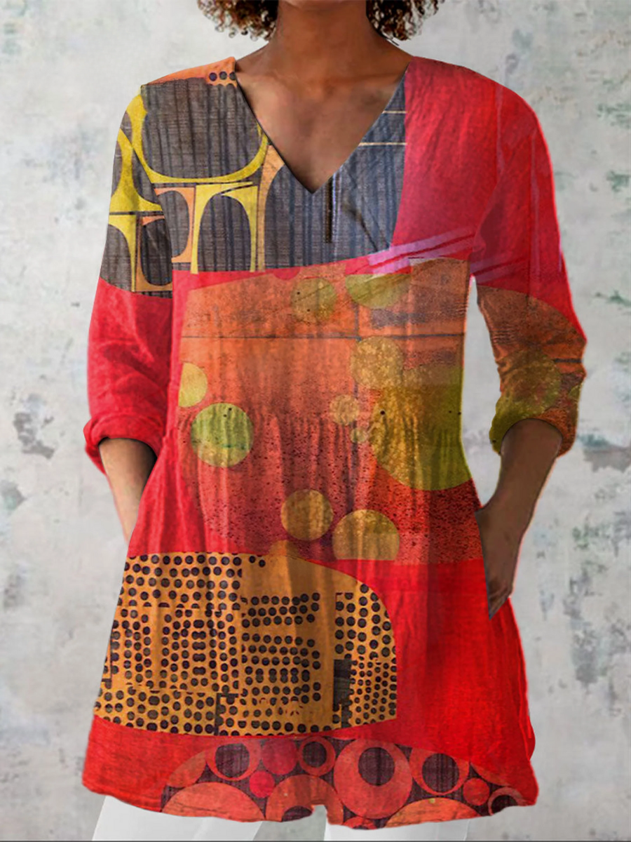 Red long V-neck blouse with abstract geometric print and 3/4 sleeves.