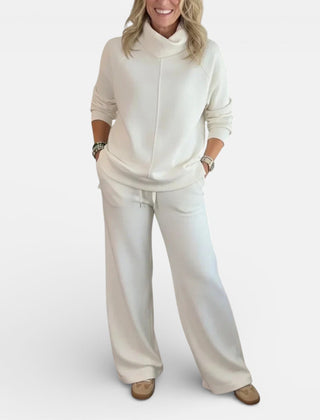 White two-piece lounge set with hooded pullover and wide-leg pants