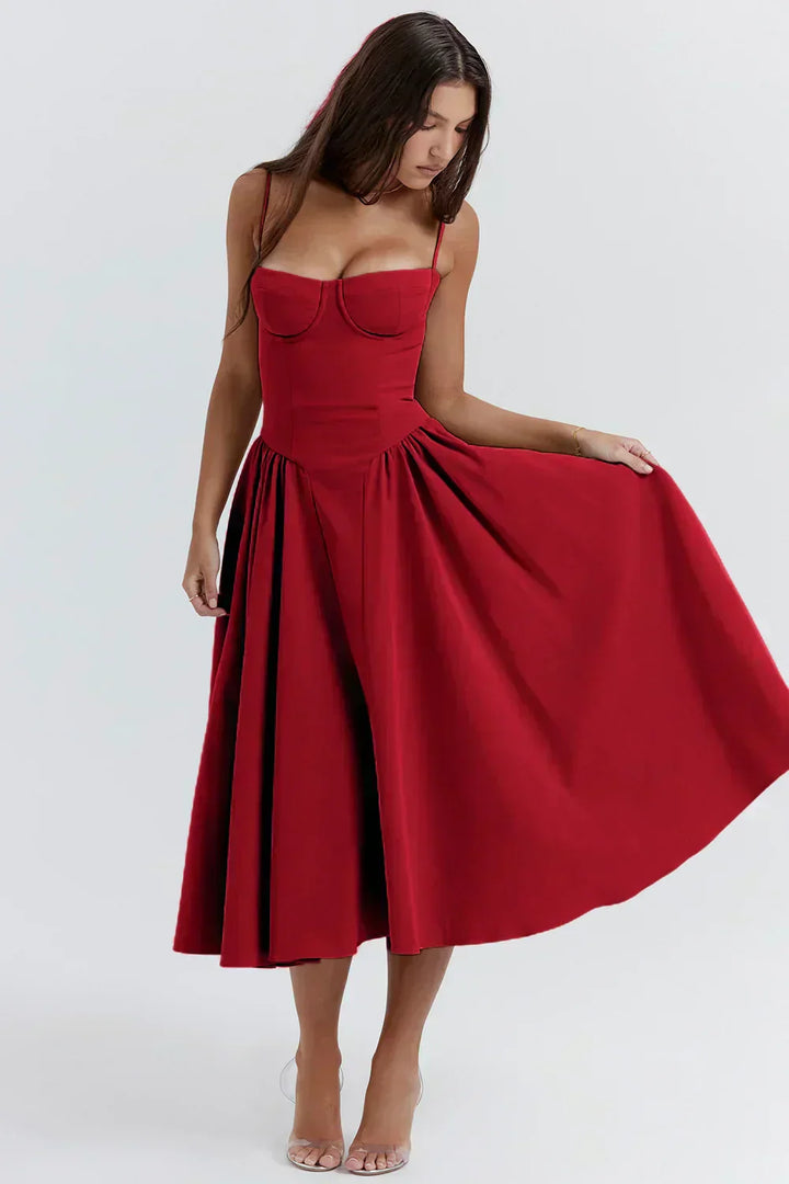 Red corset sundress with sweetheart bodice and flared pleated midi hem