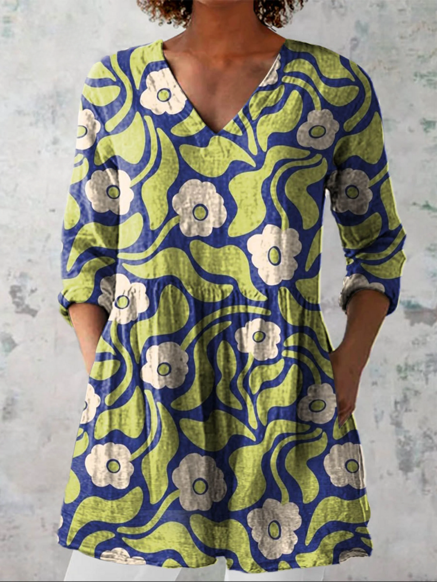 Green V-neck long blouse with 3/4 sleeves, button front, abstract flower pattern