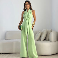 Light green sleeveless jumpsuit with wrap V-neck and tied waist, wide-leg