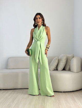 Light green sleeveless jumpsuit with wrap V-neck and tied waist, wide-leg