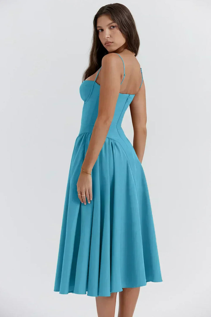 Teal corset sundress with thin straps and a pleated flared midi skirt