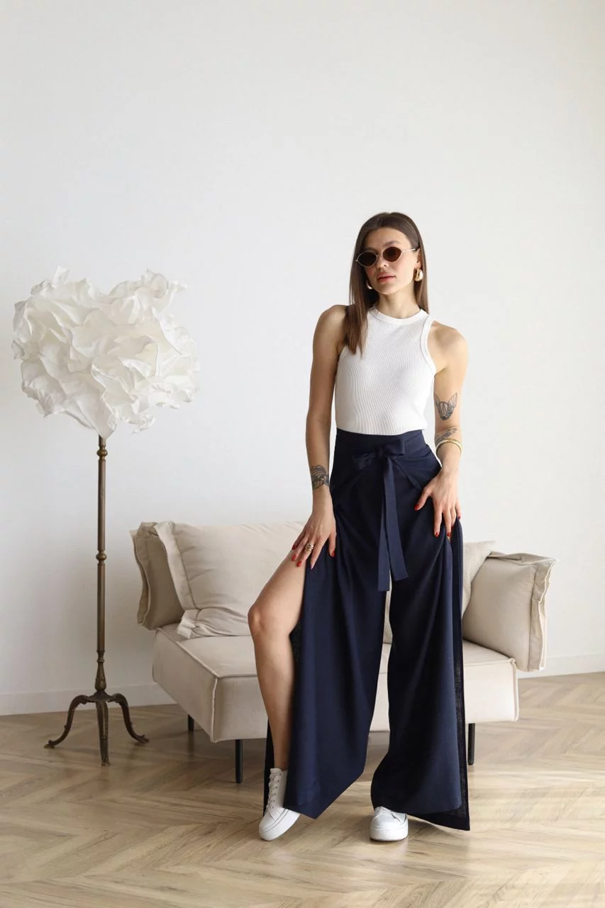 Navy wide-leg trousers with front waist tie and loose, wide silhouette
