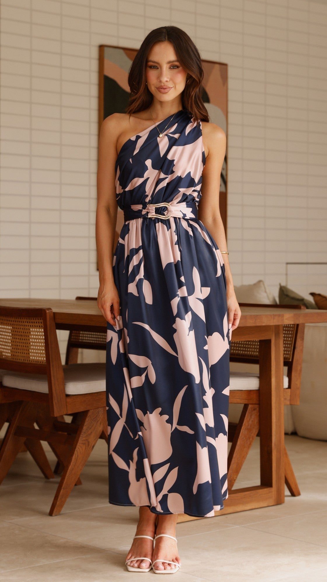 Sleeveless navy maxi dress with pink abstract floral print and tie waist belt