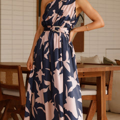 Sleeveless navy maxi dress with pink abstract floral print and tie waist belt