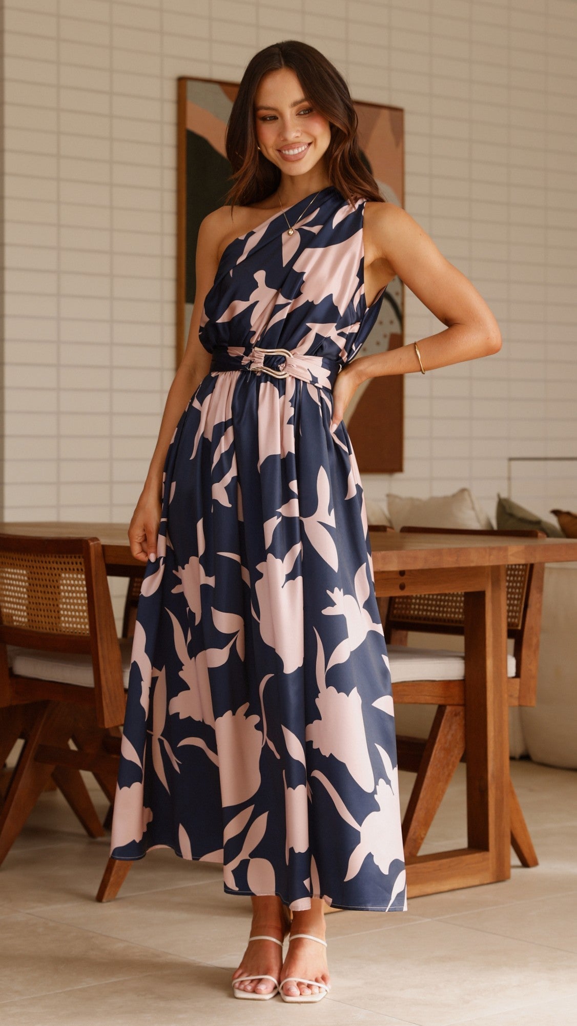 Sleeveless navy maxi dress with pink abstract floral print and tie waist belt