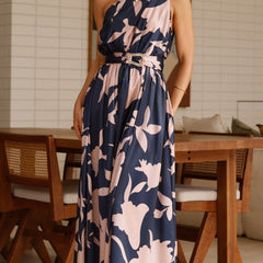Navy maxi dress with pink floral print, sleeveless, belted waist, full length front view.