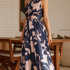 Sleeveless navy maxi dress with pink-and-cream abstract floral print and tie waist