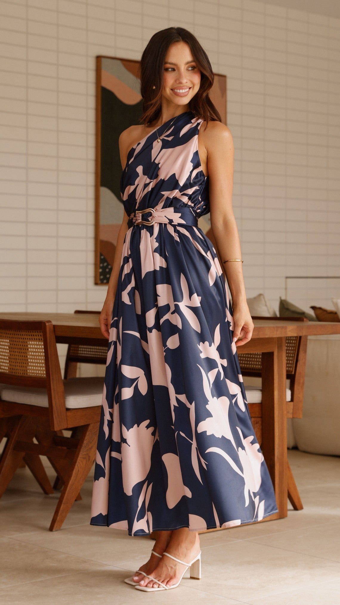 Sleeveless navy maxi dress with pink-and-cream abstract floral print and tie waist