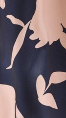Close-up of navy fabric with pink abstract floral print