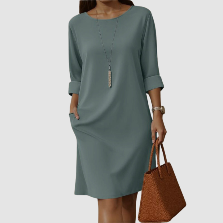 Teal green crew-neck midi dress with 3/4 sleeves and side slit, loose fit.