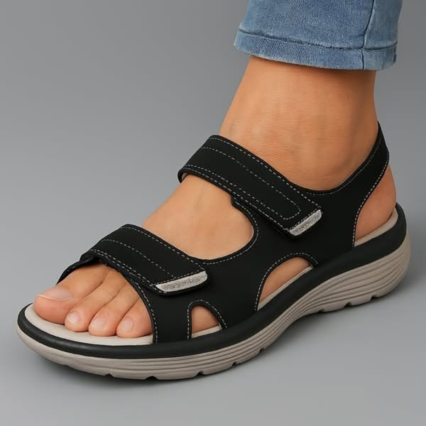 Black orthopaedic support sandal with adjustable hook-and-loop straps and cushioned sole
