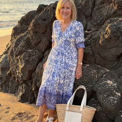 Blue floral midi dress with V-neck and gathered tiered skirt