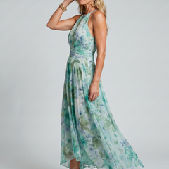 Green floral pleated halter maxi dress, gathered waist and flowing asymmetrical skirt