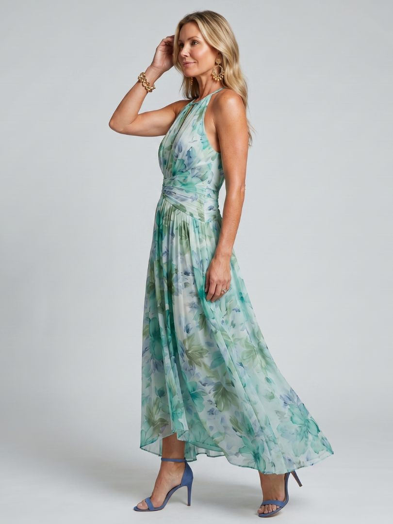Green floral pleated halter maxi dress, gathered waist and flowing asymmetrical skirt