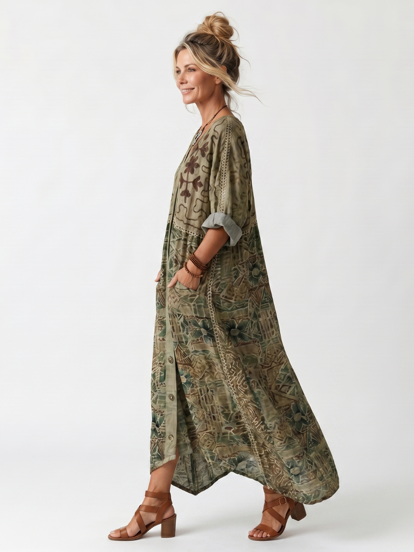 Green patterned oversized midi dress, button front and patch pockets, side view with asym hem
