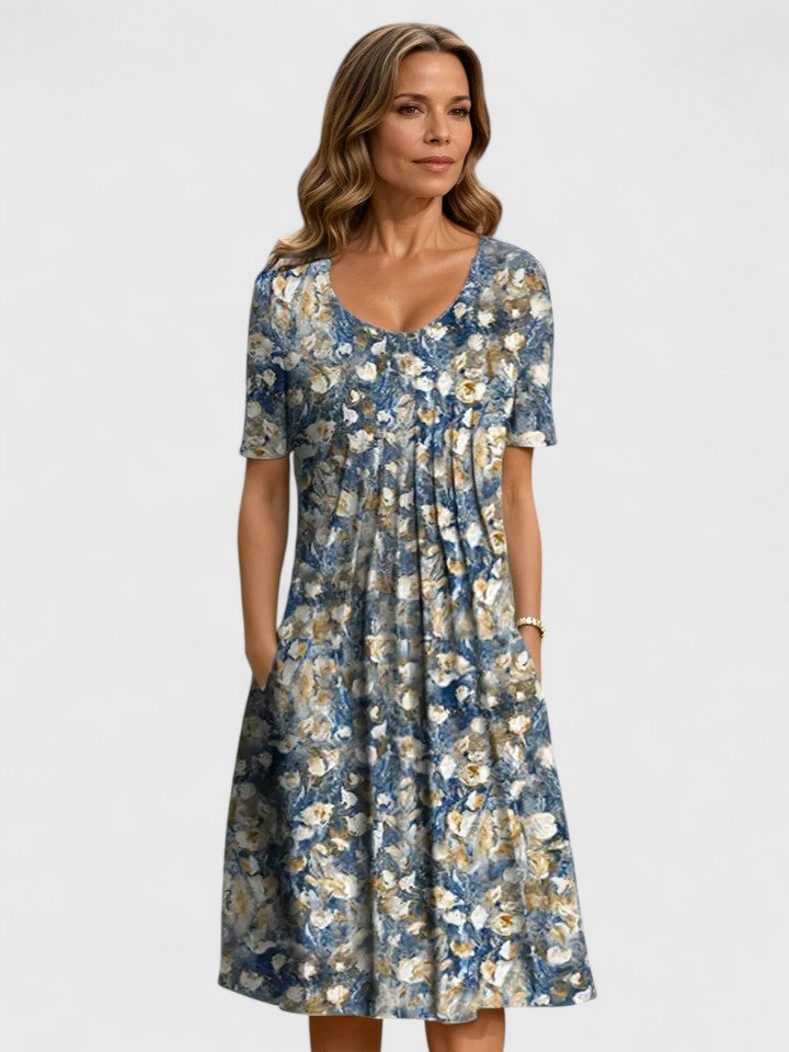 Blue floral midi dress with short sleeves and gathered skirt