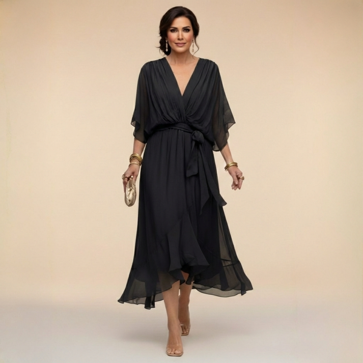 Black V-neck wrap dress with tied waist and flowing chiffon midi skirt