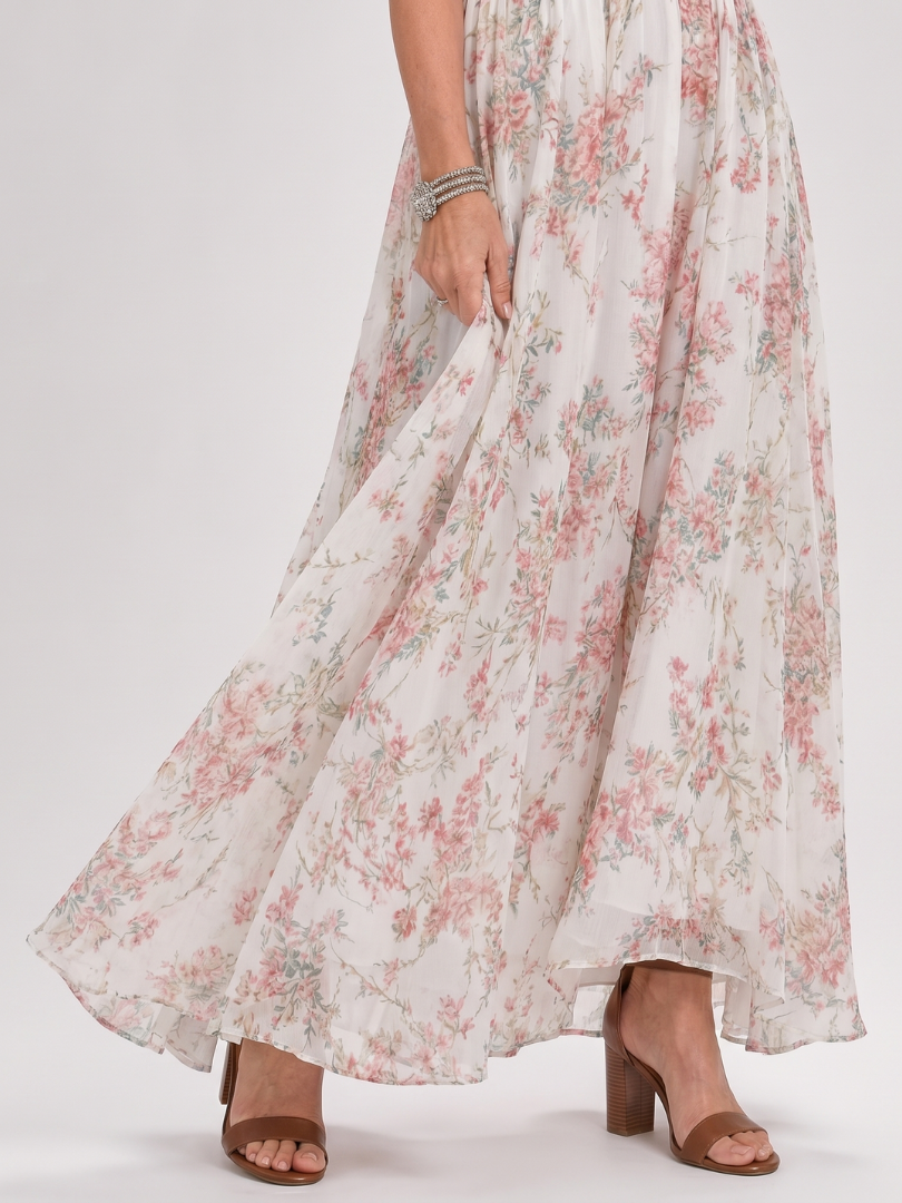 Floral halter midi dress skirt with tiered gathers and flowing hem, showing high-heel sandals