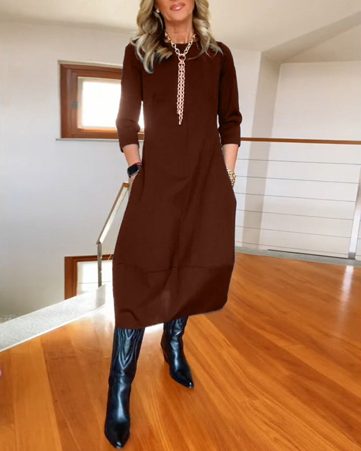 Brown solid midi dress with 3/4 sleeves and silver chain neckline detail