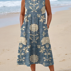 Blue sleeveless midi dress with cream floral panels and gathered skirt