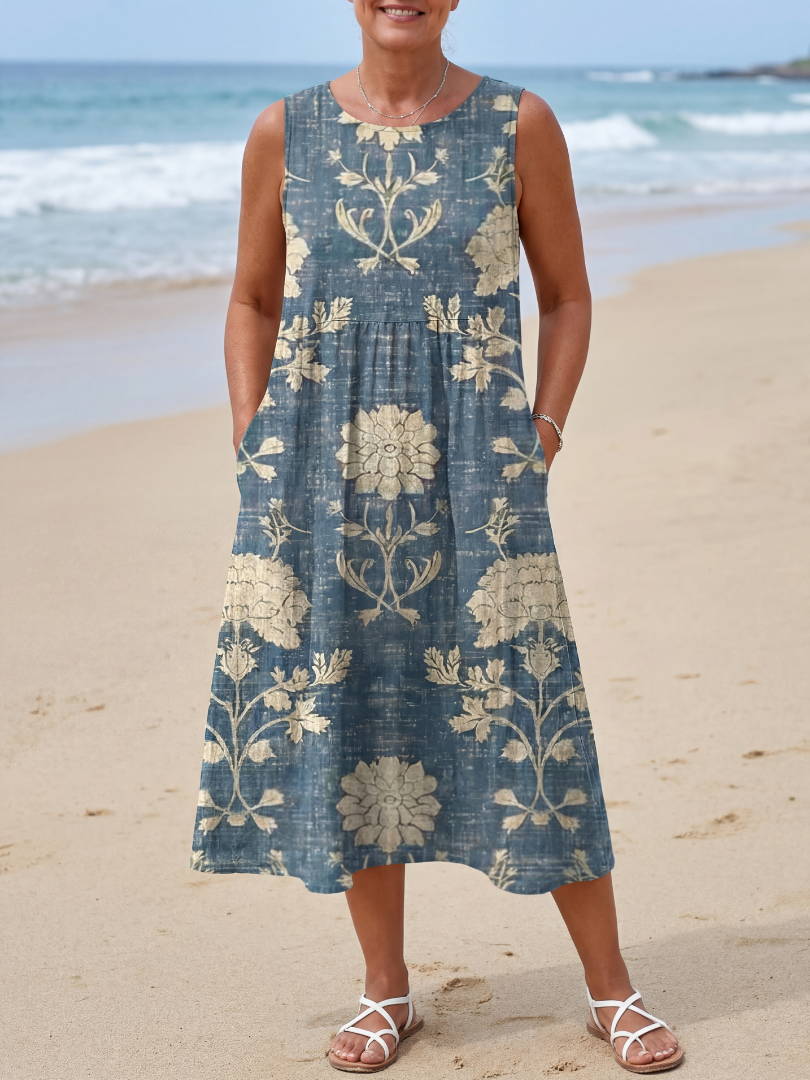 Blue sleeveless midi dress with cream floral panels and gathered skirt