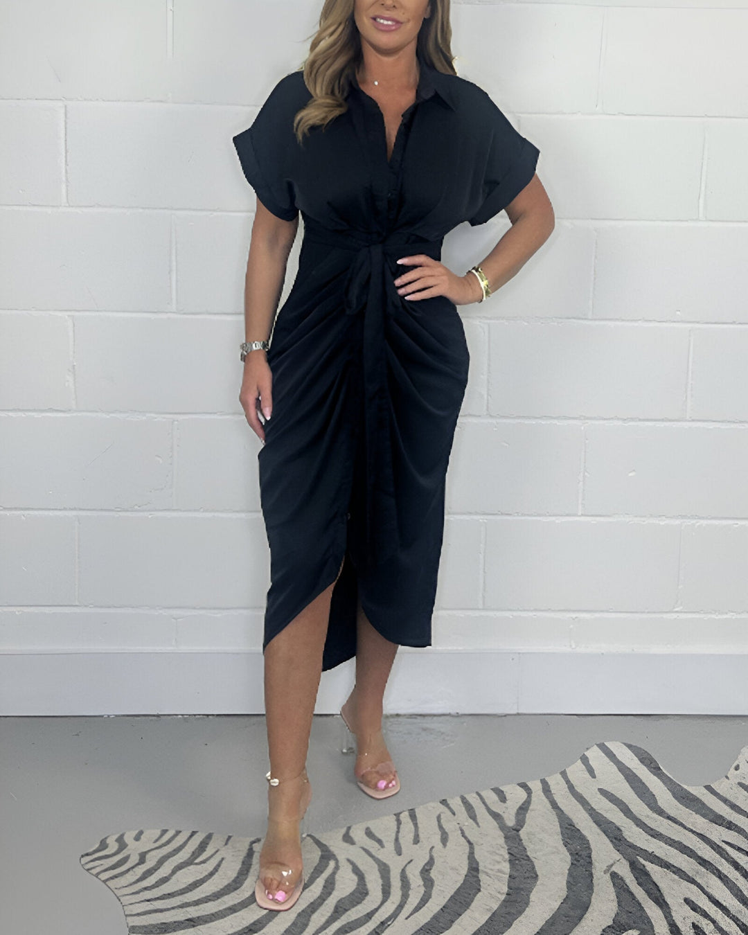 Black flared midi dress with V-neck, short sleeves, front knot and slit hem
