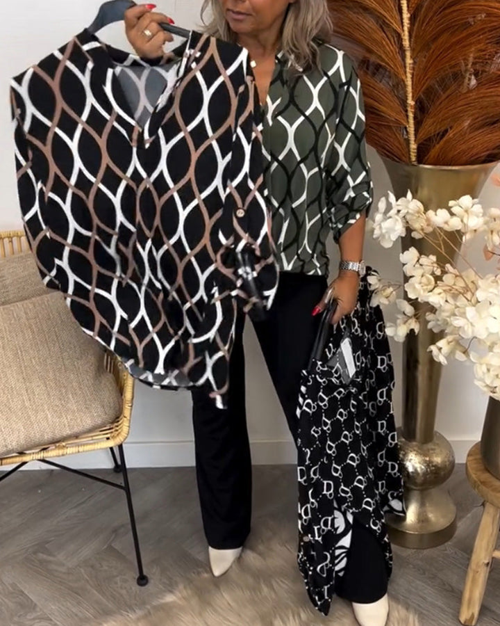 Graphic print blouse close front, black base with white oval links, V-neck with buttons