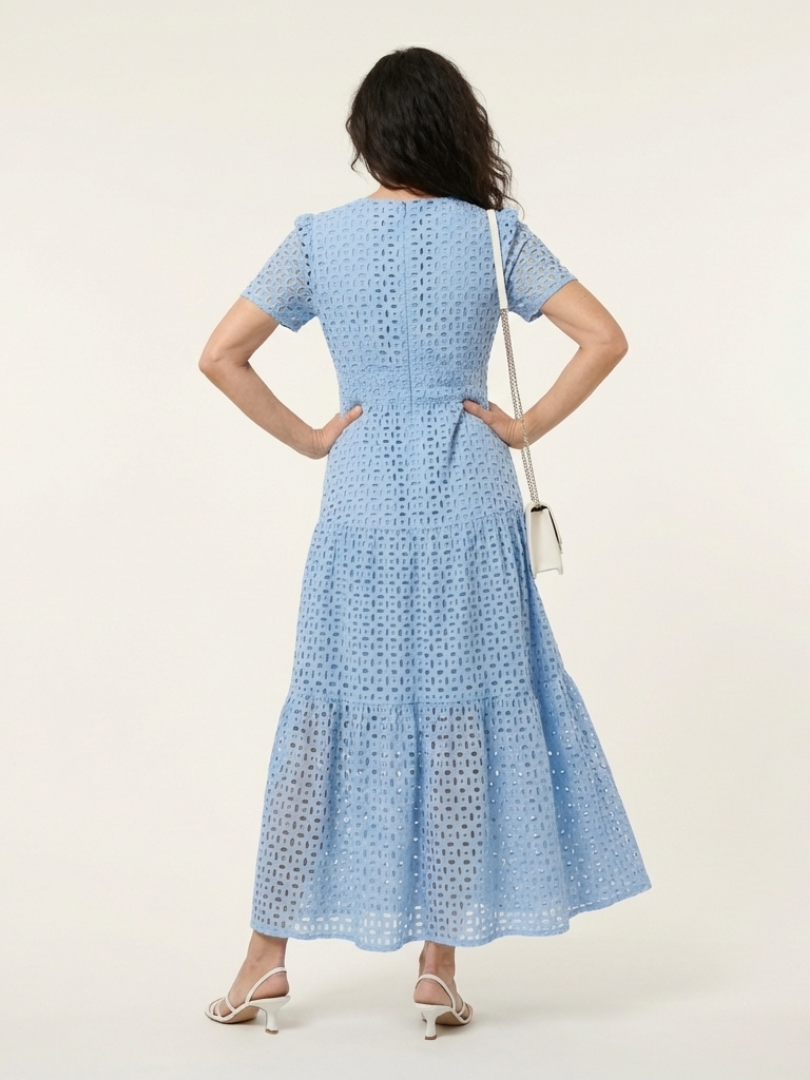 Sky blue V-neck tiered midi dress, back view, short sleeves and eyelet dot pattern
