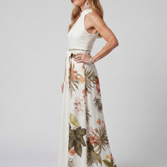 White halter maxi dress with floral-leaf botanical print and gathered waistband